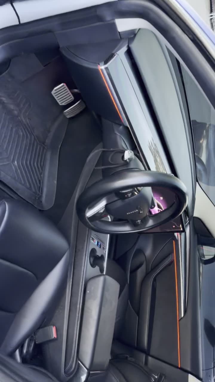 Purple and white wrapped build with red interior lighting