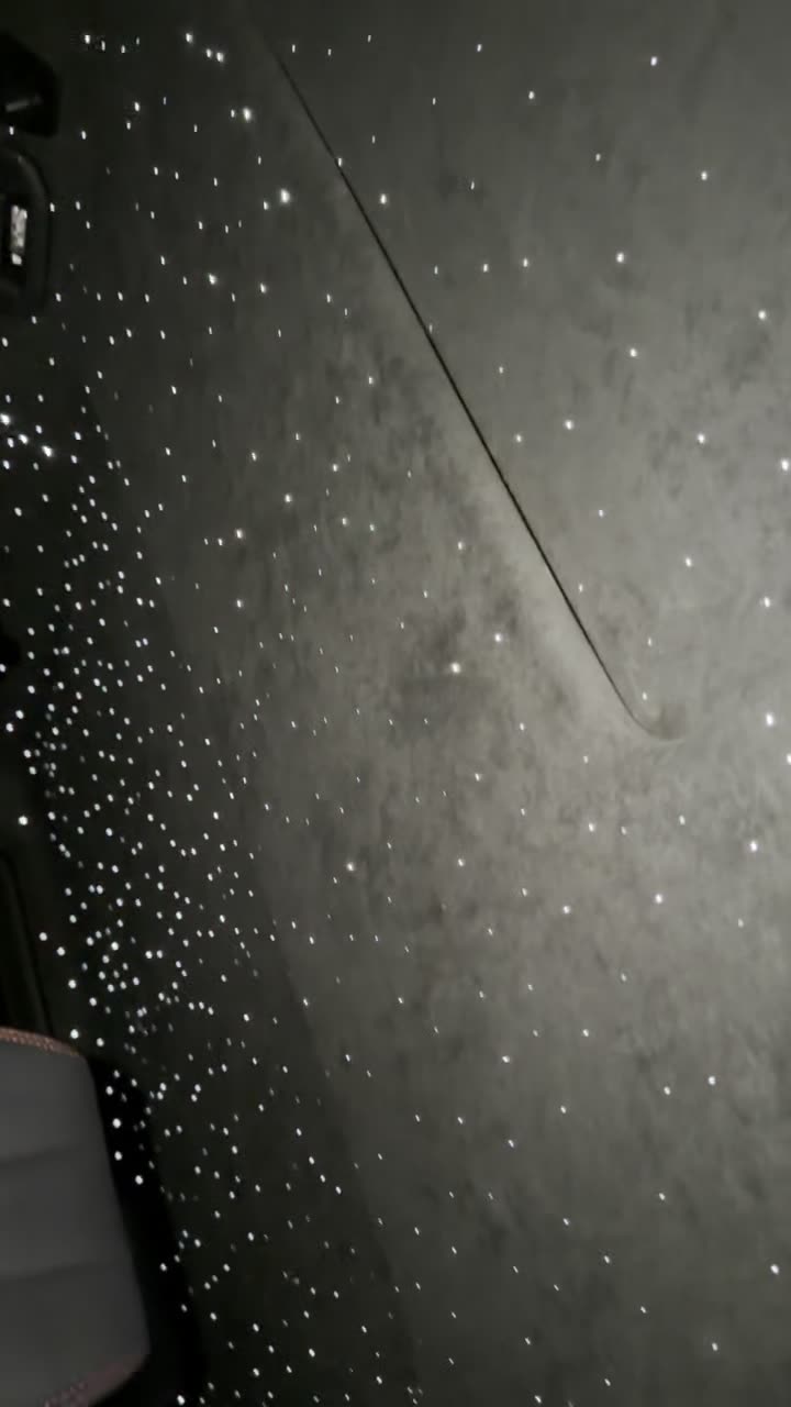 Shooting star streaking across a starlight headliner